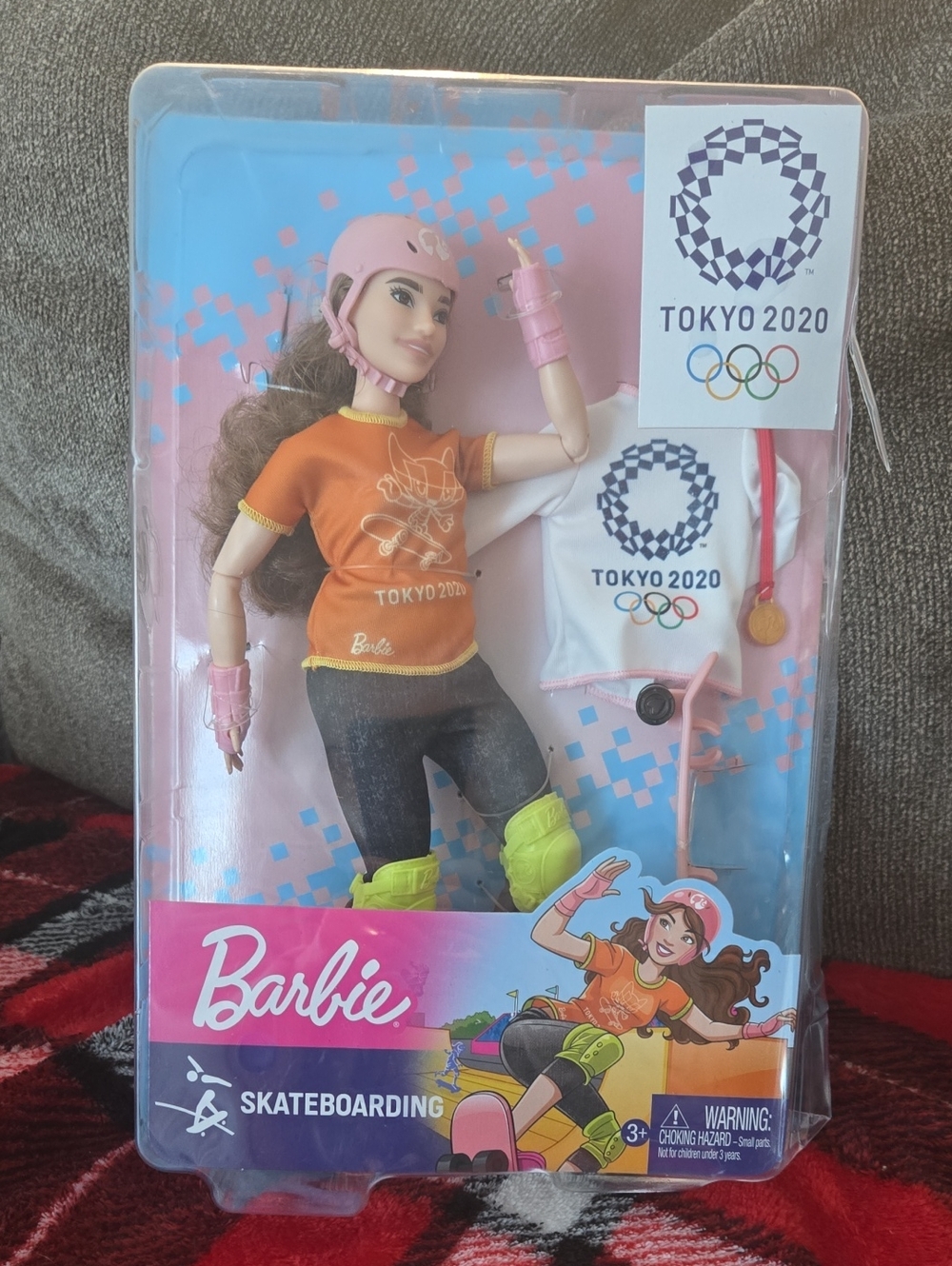 Barbie Skateboarding Doll in Orange Top with Pink Helmet and Neon Yellow Pads